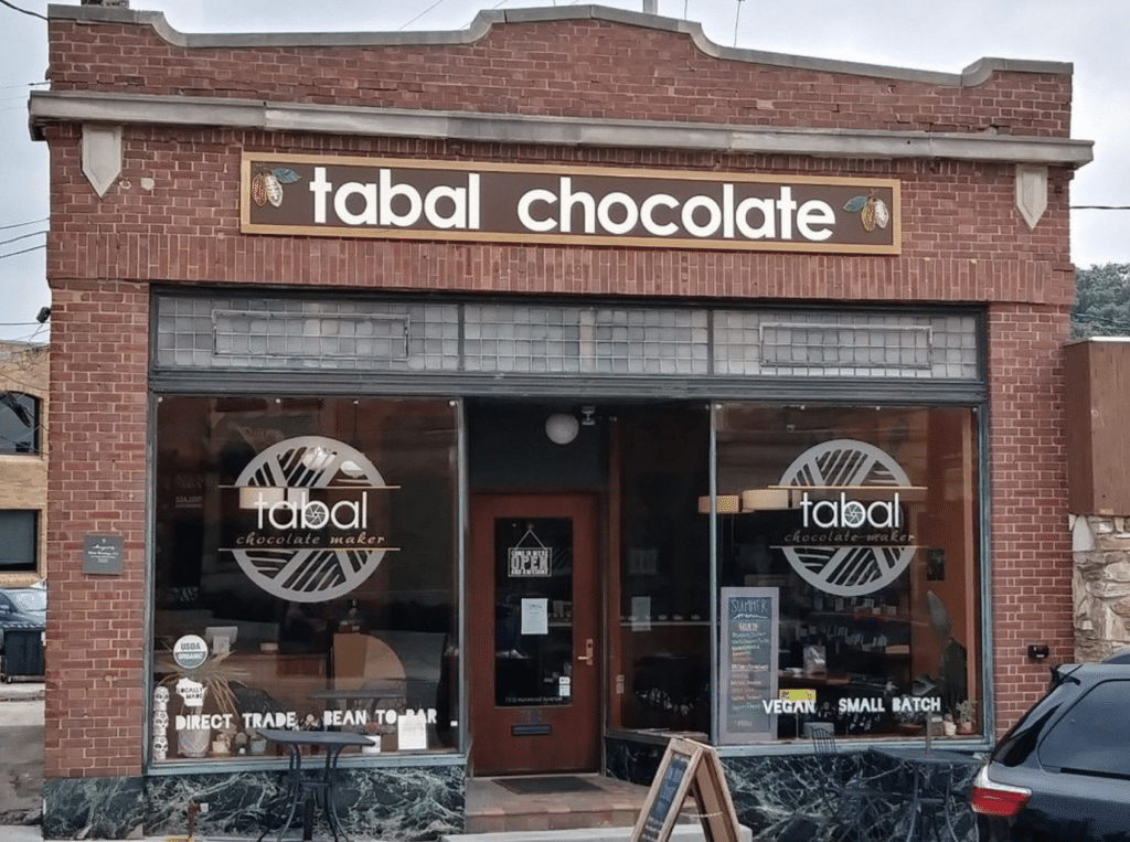 Tabal Chocolate storefront in Wauwatosa Wisconsin. Direct Trade, Bean To Bar, Vegan, Small Batch on the windows.